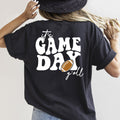 Person wearing a black t-shirt with 'It's Game Day y'all' text and football graphic.