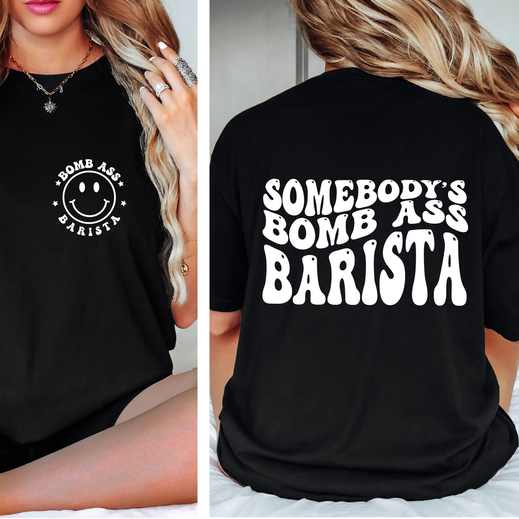 Black t-shirt with 'Bomb Ass Barista' design on front and back worn by a person.