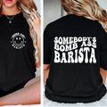 Black t-shirt with 'Bomb Ass Barista' design on front and back worn by a person.