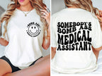 Somebody's Bomb Ass Medical Assistant T-Shirt | Funny MA Graphic Tee