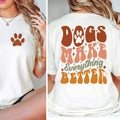White t-shirt with brown paw print on front and 'Dogs Make Everything Better' text on back