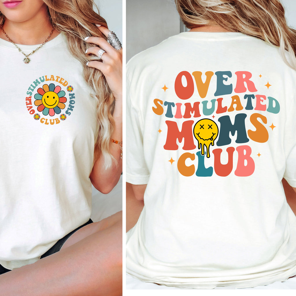 White t-shirt with colorful 'Overstimulated Moms Club' design on front and back, worn by a person.