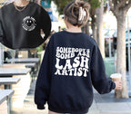 Somebody's Bomb Ass Lash Artist T-Shirt | Retro Lash Tech Graphic Tee
