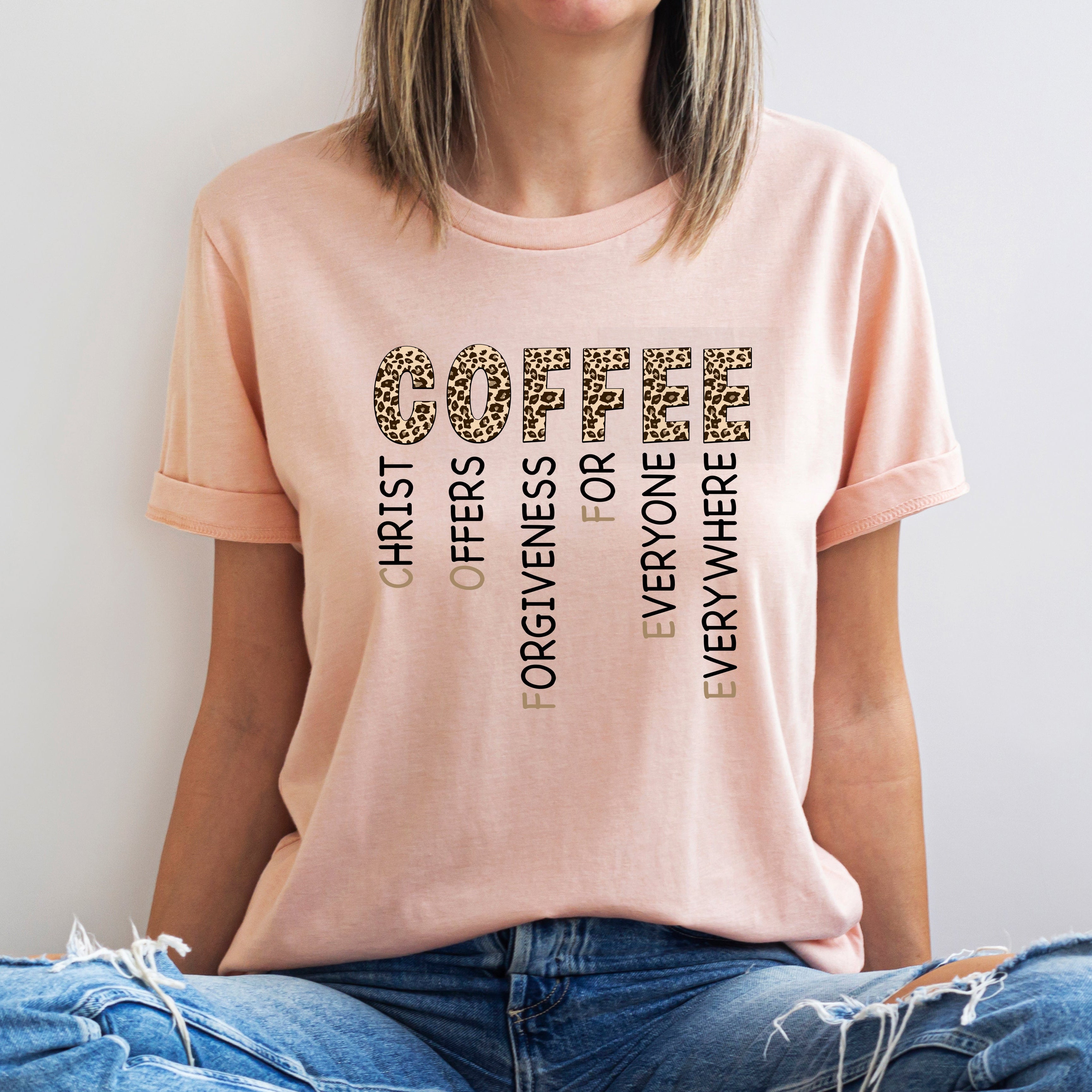 Person wearing a pink t-shirt with motivational text design.