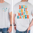 Gray t-shirt with colorful text and graphics on a plain background