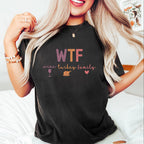Person wearing a black t-shirt with 'I'm a delight.' text, sitting on a white couch.